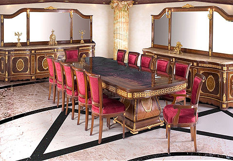 A sublime French Napoleon III style fifteen pieces Grand Royal Dining Room Set; comprising of one grand dining table, ten dining chairs, pair of dining armchairs and pair of marble topped grand buffet with mirror; detailedly and elaborately ormolu-mounted with scrolling Rinceau style foliate movements, double guilloche ormolu mounts, ribbon-tied suspending bouquet mount of draped quiver and family crest, acanthus spinosus leaves, different ormolu bands of leaf-and-dart, egg-and-dart, ribbon-tied foliate medallions, square and circular rosettes, large pierced acanthus chutes, ormolu foliate cresting, olive-bay-leaves bands and foliate keyhole escutcheons; inlaid in an exquisite floral and sprouting marquetry inlays and double sans-traverse quarter double veneer.