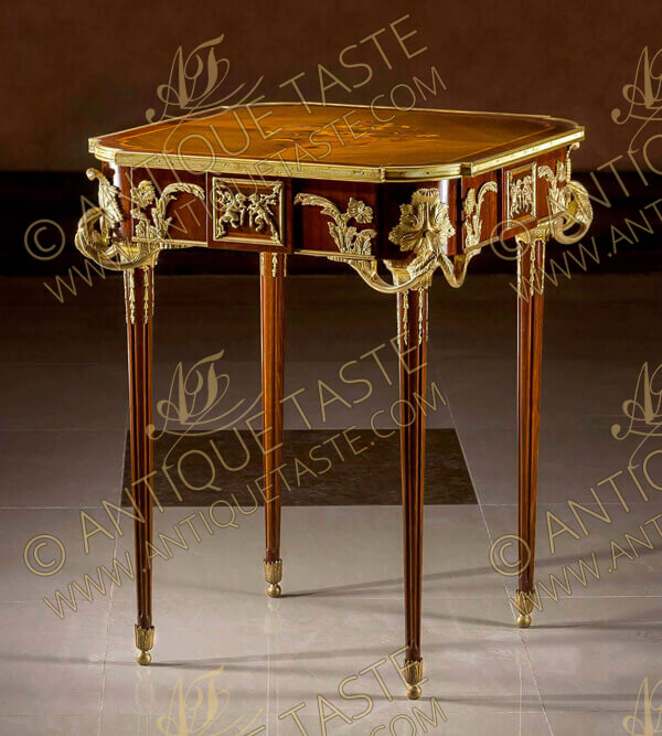 An astounding French Louis XVI style gilt-ormolu-mounted marquetry and veneer inlaid side table after the model “La Table Aux Muses” by Jean-Henri Riesener, executed later by François Linke, Paris, Circa 1900, Raised on handsome tapering fluted legs adorned with acanthus-cast sabots, ormolu floral chandelles and gilt-ormolu mottled capitals, At the top an elegant floral marquetry inlays in a different quarter veneers, all fitted within an ormolu fluted gallery, Extraordinary and high quality finely chased gilt ormolu mounts of acanthus volutes and C scrolls adorn the sides and corners of the frieze surrounding rectangular gilt-ormolu tablet decorated with finely chiseled ormolu high-relief depicting bacchanalian putti at play, The original table was supplied in 1771 for King Louis XVI's garde meuble. It was commissioned by Pierre-Elisabeth de Fontanieu, Intendant et Contrôleur général des Meubles de la Couronnefrom 1767-83. The cabinet work was made by Jean-Henri Riesener, maître in 1768, fournisseur du Garde Meuble de la Couronne from 1774 to 1784. The original is now in the permanent collection of the Musée de Versailles, on display at the Petit Trianon