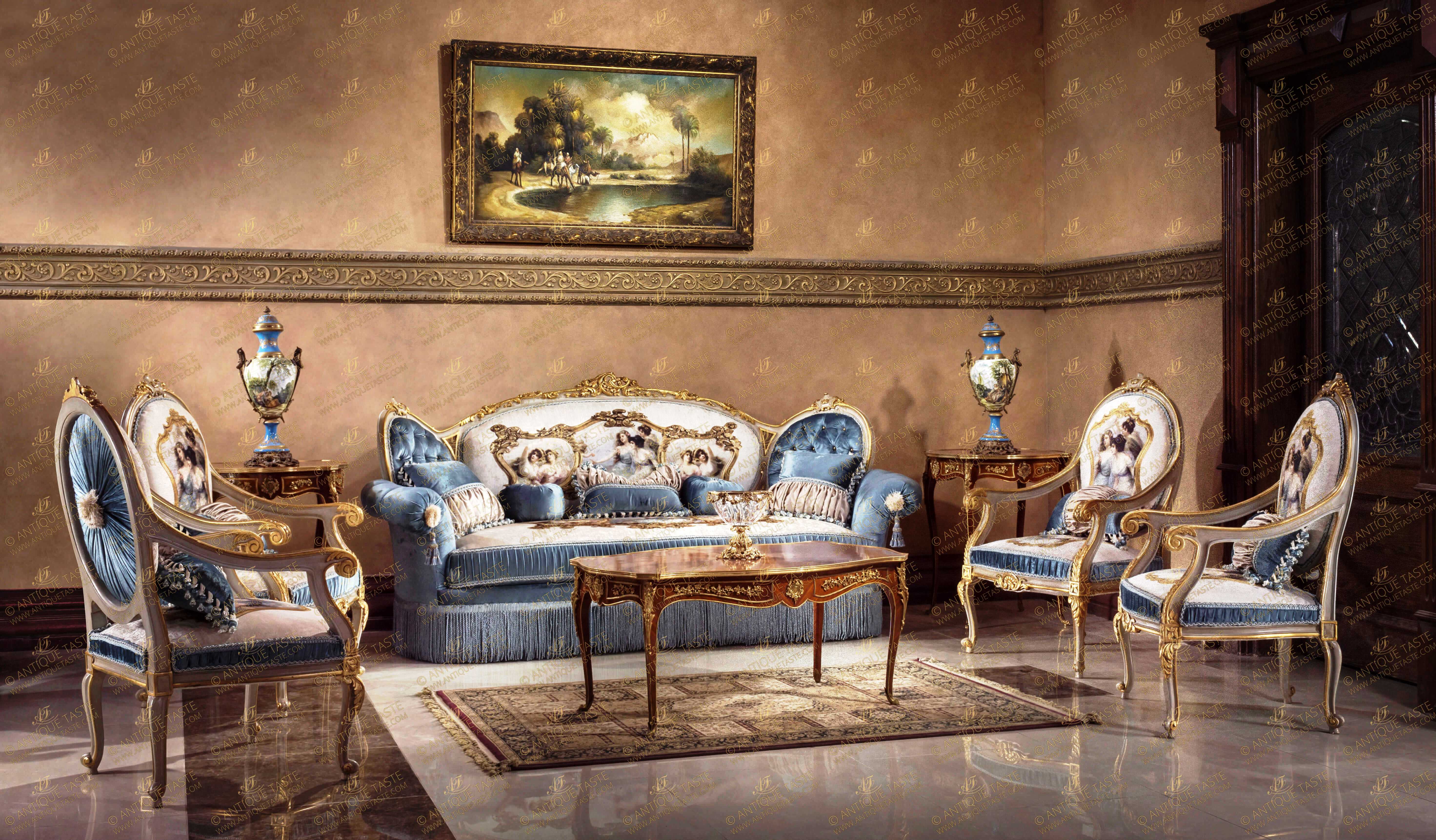 A captivating Luxury French Louis XV Rococo style five pieces Royal Sofa Suite of one sofa and four armchairs; hand carved, Shabby Chic painted and French foil parcel gilded, upholstered with sensational court scenes fabric, tassels and royal blue velvet; ornamented with scrolling pierced C works, Rococo foliage elements, shells, acanthus leaves, oak leaves, volutes and a carved Cabushon on each top.