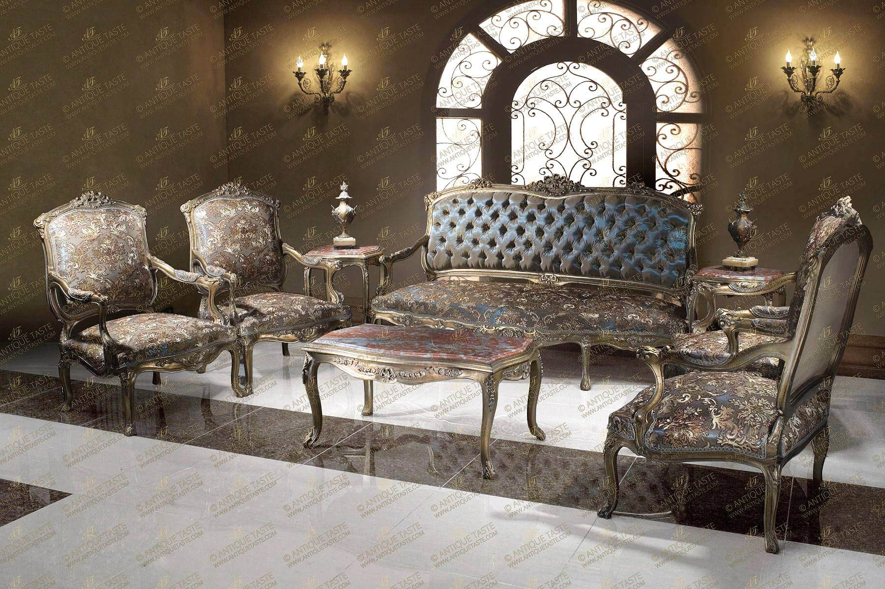 A graceful and typical French Louis XV Paris style eight pieces Salon Suite Set; comprising of one sofa, four armchairs, pair of side tables and center coffee table; elegantly hand carved, French foil gilded, patinated and distressed; upholstered with damask floral reflective fabric and tufted style to the sofa back; the fine set is raised on splayed cabriole legs and scrolling arms with upholstered armrests and adorned with mottled fillets, acanthus leaves, scroll works and pierced ribbon tied swaging blossoming floral garlands on different areas; the tables set is carved with similar carvings as the sofa and armchairs.