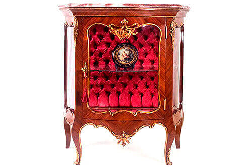 A beautiful French Louis XV style ormolu-mounted Cabinet Vitrine De Salon after the model by François Linke, elegantly ornamented with delicate ormolu filet to the contour and acanthus works, marble topped and upholstered with velvet tufted back