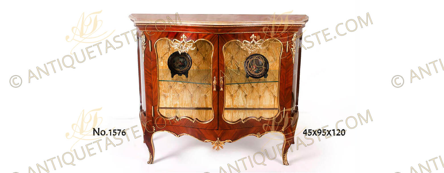 A very attractive French Louis XV style ormolu-mounted sans traverse veneer inlaid Grand Cabinet Vitrine De Salon after the model by François Linke, with double large doors, marble topped and gracefully ornamented with delicate ormolu filet to the contour with acanthus works, upholstered with velvet tufted back. Available in two versions as displayd