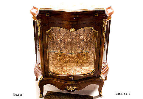 French Louis XV period ormolu-mounted veneer inlaid upholstered back Bombe shaped Cabinet Vitrin; marble topped and one upper drawer plus central glass door; resting on short bold cabriole legs adorned with acanthus leaves pierced sabots