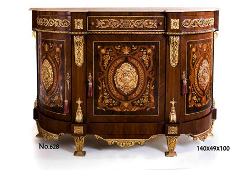 19th century Breakfront D shaped French Louis XVI style gilt-ormolu-mounted veneer and marquetry inlaid Meuble À Hauteur D'appui, The breakfront marble top above a same shaped frieze with an ormolu bordered central drawer flanked by two faux drawers, all are ornamented Rinceau Guilloche ormolu design, separated and terminated by four blocks adorned with ormolu rosettes surmounting an entwined Bead-and-Real ormolu band above four medallions in shape of volute with Acanthus leaf and four shaped chutes of ormolu acanthus volute brackets to the confronting part, The central part has three cupboard doors sans traverse quarter veneer and foliate marquetry patterns inlaid, each door is accented with fine chiseled ormolu plaque depicting urn issuing flower bouquet encircled branches and scrolls and each door with ormolu keyhole escutcheon, The bottom apron has four blocks with ormolu rosettes and three central reverses with large ormolu mounts of scrolling leaves, The fine piece is raised on tapering ormolu supports
