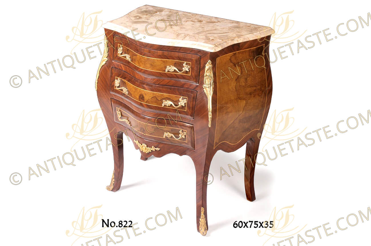 A fine French Louis XV style ormolu-mounted and marble topped three drawers curved bombe shaped Mahogany veneer inlaid Commode, adorned with foliate ormolu handles, acanthus long chutes and acanthus leafy sabots on the splayed cabriole legs