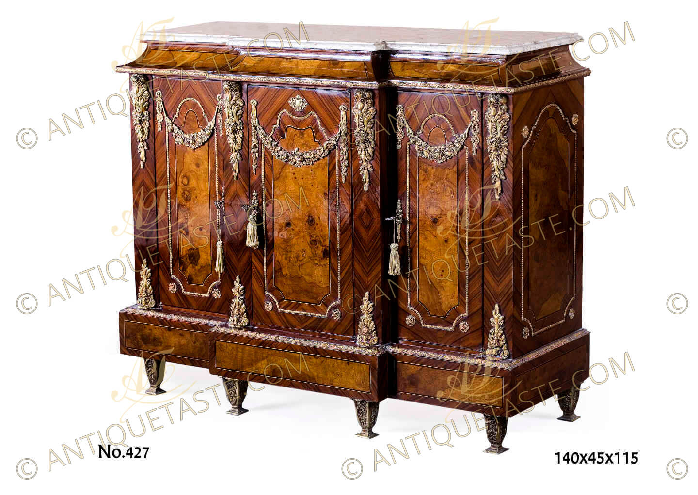 A most elegant late 19th century French Transitional style veneer inlaid three doors meuble à hauteur d'appui , The breakfront moulded marble top above a conforming mahogany veneer inlaid and filet bordered breakfront concave apron with a hammered ormolu band above three doors, the central door elegantly protrudes forward with a central ormolu cabochon amidst the other two doors, all doors quarter sans traverse palisander veneer inlaid, centered with mahogany veneer inlay within filet and ormolu beaded encadrement with flower rosettes, topped with  impressive blossoming swaging festoons and flanked with richly chased chutes ormolu mounts of acanthus, wreaths and imbricated foliage, the sides have the same design, All above a breakfront veneer inlaid protrusive plinth topped with a Cyma Recta style ormolu trim on ormolu leafy tapering feet