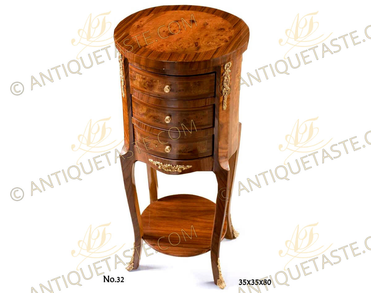 French Transitional style cylindrical shaped ormolu-mounted double veneer inlaid Night Stand, with three drawers and circular stretcher, ornamented with entwining ormolu chutes