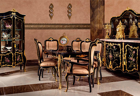 A resplendent French late 19th Century Louis XV style eleven pieces royal Dining Room Set after the model by François Linke; ebonized and highly finished in Black lacquer and hand painted with floral designs in the Vernis Martin style; exquisitely ormolu-mounted with finely chiseled scrolling foliage, waterfall, large acanthus chutes mounts, laurel-wreath cresting, acanthus leaves, swaging garlands, hammered ormolu bands, ribbon-tied cresting mounts and polished pierced ormolu works; the elegant set is comprising of a dining table, six dining chairs, pair of armchairs, one buffet with mirror and one display cabinet.