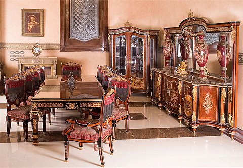 A statement making French Louis XIV style thirteen pieces elite grand Dining Room Set; elaborately and richly ormolu-mounted with acanthus leaves, cyma recta designs, ormolu scrolling foliage, pierced ormolu works, Rinceau designs, Egg-and-Darts, double guilloche, suspending blossoming garlands and eternal fire finials; inlaid in sans traverse quarter veneer and floral marquetry patterns; the fine set has been produced and sold to Royal Families around the world and elite estates in U.S.A and Europe; the fine set is comprising of a grand dining table, eight dining chairs, pair of arm chairs, grand buffet with mirror and one display cabinet.