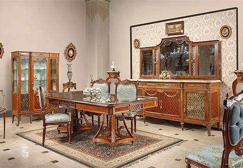 A spectacular French Louis XVI Neoclassical style thirteen pieces Regal Dining Room Set; inlaid in sans traverse quarter veneer and diamond parquetry design; appealingly distressed ormolu mounted with swaging blossoming garlands, bayberry, diamond shaped ormolu galleries, scrolling acanthus chutes, grand foliate rosettes, acorn finials, urns with flower bouquets and acanthus sheathed paw feet; the elegant set is comprising of one grand dining table, ten dining chairs, one grand buffet with mirror and one display cabinet.