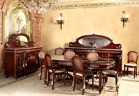 A Traditional French Louis XVI style eleven pieces solid walnut Dining Room Set, finely ormolu-mounted with richly chased ribbon-tied swaging garlands, scrolling foliage, ormolu rosettes, ormolu chandelles on the fluted tapered legs, ormolu blossoming ribbon-tied chutes mounts and ormolu swaging medallion; veneer inlaid and diamond parquetry designs; the set is comprising of a dining table on x-stretcher, caned back eight dining chairs and pair of different size buffet with mirror, their glass paned cupboard doors have carved wooden crossbars.