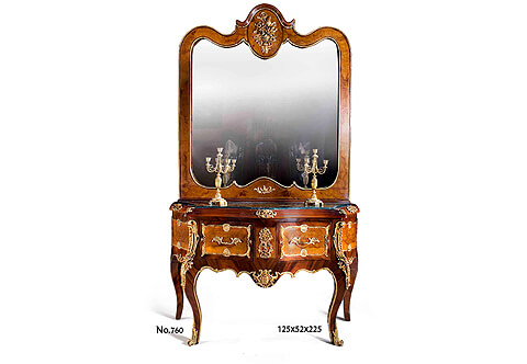 A sophisticated French Louis XV style ormolu mounted sans traverse veneer inlaid two drawers console with mirror, The large mirror curved top crown centered with a marvelous ormolu flower bouquet and foliate ormolu mounts at each corner with an ormolu border, The console commode shaped table below topped with an inset marble in the beveled frieze which is ornamented with pierced ormolu mounts above two deep drawers elaborately bordered with foliate scrolled ormolu mounts centered with palmettes and a fine pierced leafy ormolu handles. The drawers are separated with a block decorated with a fine cast ormolu mount, The console is raised on bold cabriole legs headed by spectacular large richly chased ormolu chutes with a top pierced design of fanciful blossoming leaves and terminating with stunning turning ormolu sabots, The console table scalloped lower frieze with central ormolu reverse of a fine chiseled cartouche issuing scrolled ormolu filet continues all around the contours. The sides have the same design and ormolu mounts of the front, The console is produced in different veneer inlays and diverse ormolu mounts