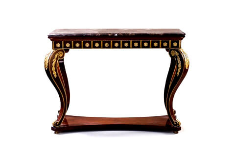 A statement making 19th century French Louis XV style freestanding ormolu-mounted veneer inlaid console table, Raised on four moulded and gilded bun feet below S scrolled robust volute cabriole legs connected by a bottom tier with concave sides and a mahogany quarter veneer pattern, The front of each leg is beautifully headed with a large ormolu acanthus leaf, each volute side is decorated with ormolu flower rosette issues ormolu leafy garland, terminating with a scrolled end adorned with a gilt-ormolu acanthus leaf, The outer contour of the legs is bordered with an ormolu band, above is the rectangular shaped apron with successive ormolu rosettes within ormolu squares under the beveled marble top