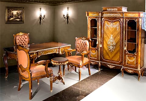 An opulent French 19th century Louis XV style veneer inlaid and ormolu Bureau Plat after the model by Theodore Millet, The desk is raised by four elegant cabriole legs decorated by richly top chased ormolu mounts above ormolu chutes elongated with foliate ormolu trim to the turned wrap around acanthus sabots, At the scalloped frieze are three drawers with highly detailed foliate ormolu filets in a satin and burnish finish which frame the veneer inlays. Each drawer is elaborately bordered with foliate scrolled ormolu mounts and foliate ormolu handles with ormolu keyhole escutcheon to the central recessed drawer, the back is similarly decorated with the same design on the three faux drawers, at the top is fine leather writing surface within a rosewood border and Cyma Recta style ormolu scalloped trim extremely finely chased throughout