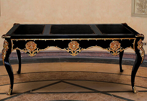 A Luxuriant French Louis XV period gilt-ormolu-mounted ebonized wood Executive Writing Desk