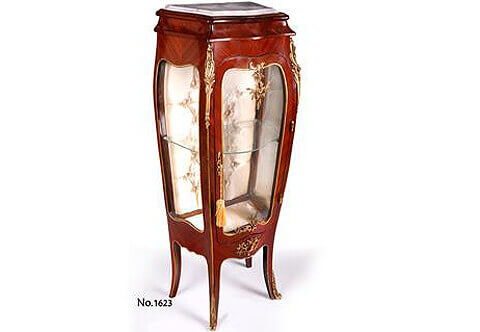 A stately petite French Louis XV style bombe shaped ormolu-mounted sans traverse veneer inlaid Vitrine Stand after the model by Francois Linke late 19th century, Sans Traverse quarter palisander veneer inlaid, Intricate foliate ormolu mounts, Marble topped, Brass bands, Scalloped Aprons, Built In Drawer, Glazed door, sides and glazed shelf, Foliate ormolu keyhole escutcheon, capitoné style silk fabric upholstered background, Cabriole splayed legs