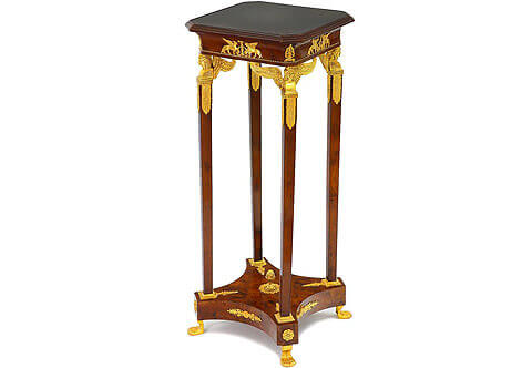 Jacob Desmalter Empire style Pedestal, Luxurious Pedestals, Jean-Henri Riesner Pedestal, Francois Linke Pedestal, Maison Millet Pedestal, Corners Decoration, French style Stand, Andres Charles Boulle Pedestal, Theodore Millet Style Pedestal, Robert Adam style Vase Stand, Empire Style Pedestal, Vitrine Stands, Louis XV style Pedestals, Bombe Shape Stand, Louis XVI Pedestals, Ormolu-mounted Stand, English style Pedestal, Empire style Pedestal, George III style Pedestals, Heritage Pedestals, Display Stands, French Empire style gilt-ormolu-mounted veneer inlaid Pedestal on the manner of Jacob Desmalter, The inset marble top within a moulded fluting frieze above a conforming slightly concaved apron decorated with winged mythological creatures ormolu mounts and anthemion ormolu mounts on each corner, all on a twisted ormolu band, The top rests on fine and intricately chiseled four winged caryatid pilasters, each headed by a head and winged bust of a beautiful Egyptian female figure wearing a royal Egyptian headdress over ringlet hair, set on an angular plinth with beaded base and four ornamental acanthus foliage to each side, upon a slightly tapering pilasters support terminate with leaf-and-dart ormolu frame and issue a palmette, all point to a central pinecone rosettes. The four pilasters rest on a concave sided bottom tier ornate with ormolu palmettes and flower rosettes on the angular spas and raised on ormolu female feet