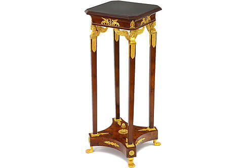 Jacob Desmalter Empire style Pedestal, Luxurious Pedestals, Jean-Henri Riesner Pedestal, Francois Linke Pedestal, Maison Millet Pedestal, Corners Decoration, French style Stand, Andres Charles Boulle Pedestal, Theodore Millet Style Pedestal, Robert Adam style Vase Stand, Empire Style Pedestal, Vitrine Stands, Louis XV style Pedestals, Bombe Shape Stand, Louis XVI Pedestals, Ormolu-mounted Stand, English style Pedestal, Empire style Pedestal, George III style Pedestals, Heritage Pedestals, Display Stands, French Empire style gilt-ormolu-mounted veneer inlaid Pedestal on the manner of Jacob Desmalter, The inset marble top within a moulded fluting frieze above a conforming slightly concaved apron decorated with winged mythological creatures ormolu mounts and anthemion ormolu mounts on each corner, all on a twisted ormolu band, The top rests on fine and intricately chiseled four winged caryatid pilasters, each headed by a head and winged bust of a beautiful Egyptian female figure wearing a royal Egyptian headdress over ringlet hair, set on an angular plinth with beaded base and four ornamental acanthus foliage to each side, upon a slightly tapering pilasters support terminate with leaf-and-dart ormolu frame and issue a palmette, all point to a central pinecone rosettes. The four pilasters rest on a concave sided bottom tier ornate with ormolu palmettes and flower rosettes on the angular spas and raised on ormolu female feet