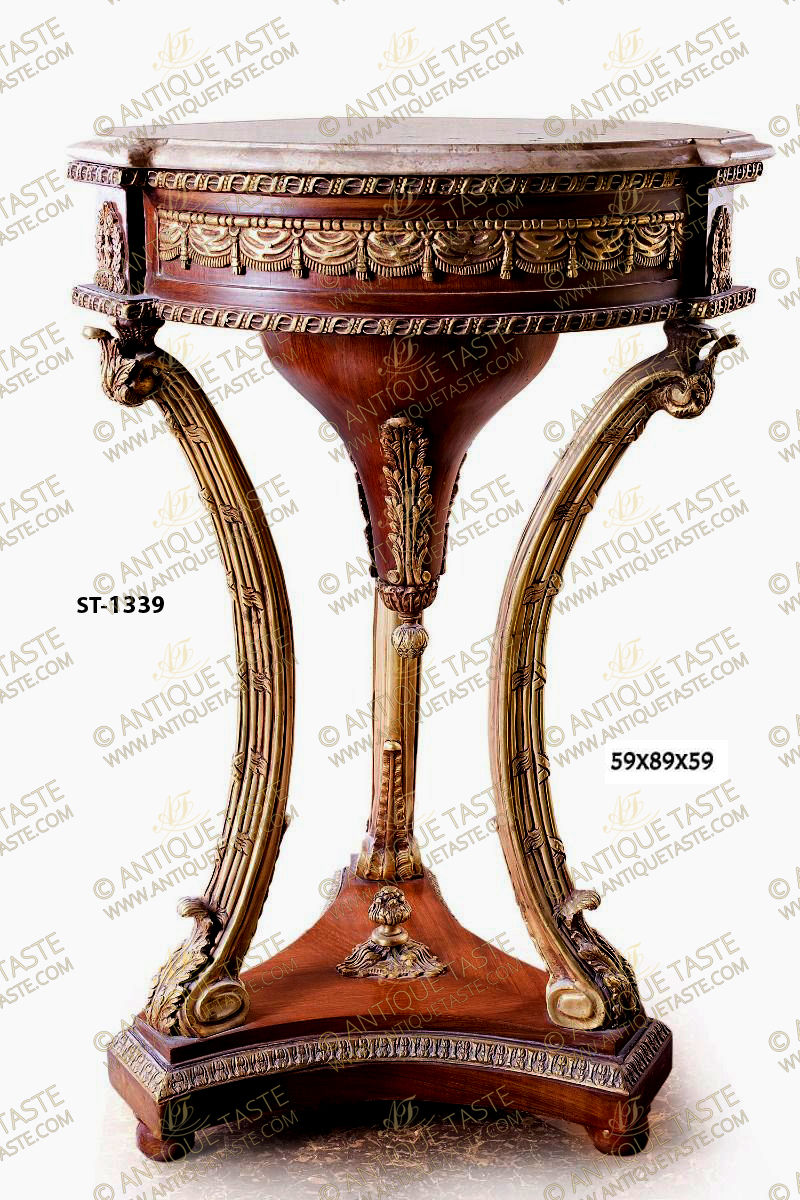 A marvelous French Napoleon III style ormolu mounted veneer inlaid Athénienne / Tripod Plant Stand; The shaped circular marble top rests on shaped ormolu mounted blocks of the conforming frieze which is ormolu adorned with scalloped draperies and brass bands, the faux bulbous reservoir beneath with gilt ormolu acanthus leaves descending to an ormolu pineball terminal, the top part above three inward curved ormolu supports finely chiseled with acanthus leaves finials all above an incurved tripartite base with leaf-and-dart ormolu rim, central leafy acorn finial and three bun feet.