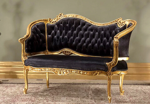 A prestigious 19th Century French Rococo Louis XV style Loveseat Settee, intricately hand carved, French foil gilded and patinated; raised on foliate adorned scrolling delicate legs with a central reverse ornamented with a central acanthus leaves issuing swaging garland; the curved winged sides are in tufted style upholstery with scrolling acanthus leaves connected to the majestic back embellished with pierced carvings and typical Rococo elements of scrolling acanthus leaves; the fine piece is upholstered in pair of harmonious velvet and damask fabric match, also in black velvet as displayed; can be finished in color or fabric choice per client request.