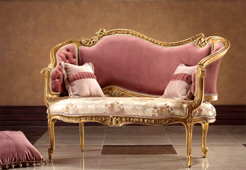 A prestigious 19th Century French Rococo Louis XV style Loveseat Settee, intricately hand carved, French foil gilded and patinated; raised on foliate adorned scrolling delicate legs with a central reverse ornamented with a central acanthus leaves issuing swaging garland; the curved winged sides are in tufted style upholstery with scrolling acanthus leaves connected to the majestic back embellished with pierced carvings and typical Rococo elements of scrolling acanthus leaves; the fine piece is upholstered in pair of harmonious velvet and damask fabric match, also in black velvet as displayed; can be finished in color or fabric choice per client request.