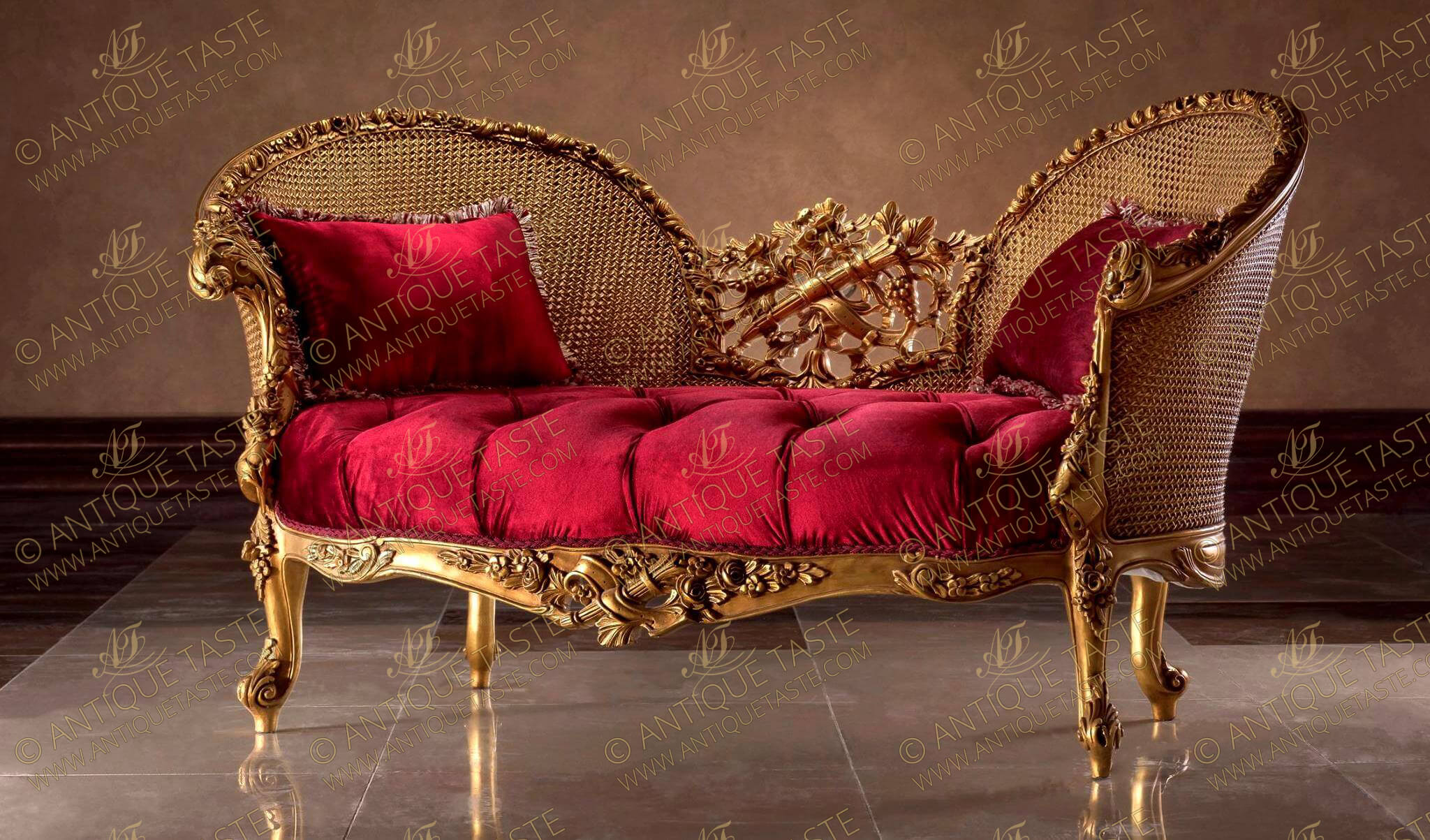 French Transitional Style Canapé en Corbeille; A loveseat sofa Marquise; Hand carved and French foil gilded; Raised by flowering acanthus cabriole turned legs flanking a carved frieze centered by a richly carved floral pierced cabochon centered by a ribbon-tied bow quiver amidst blossoming flowers; Each scrolled arm is richly handcrafted with foliate carvings and acanthus C works leading up to a continuous blossoming frame all around the contour of the wicker cane high wing C shape back which is centered with an exquisite pierced works of grape-vine trellis and blossoming acanthus leaves surrounding a ribbon-tied quiver. The fine piece is a true statement piece mixing the Rococo and Baroque carving elements in a harmonious result. One of our large volume demanded pieces.
