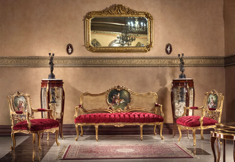 French 19th century Louis XV, Rococo and Vernis Martin Salon Set of one sofa and two armchairs; raised by fine cabriole legs with elegant scrolled feet; above each leg is a lovely acanthus carving, centered by an arbalest shaped frieze, with an elegant carved foliate scrolling reserve; upholstered with velvet in tufted style the fascinating back of the set is in cane and exquisite acanthus carvings, vines and scrolling blossoming foliage centered with different hand paintings of romantic court scenes inspired from François Boucher collections