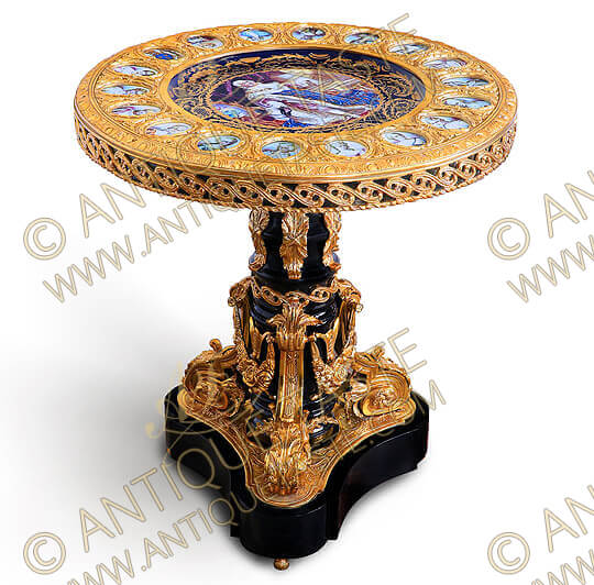 An enchanting Napoleon III Ormolu-Mounted and cobalt-blue ground Sèvres porcelain plaques ebonised Gueridon of Louis XVI Style after the model circa 1870, This exceptional gueridon with circular top inset with a large cobalt-blue ground miniature of king Louis XVI, surrounded by eighteen further porcelain miniatures of courtly members, all within an engraved gilt-ormolu surrounding border of Egg-and-Dart style above a single guilloche gallery, Raised on an ebonized stem supported by gilt-ormolu leaf-cast scrolls, volutes and Bay Leaves, on an ebonized concave-sided tripartite plinth, The table is available as well in another Sèvres porcelain plaques and miniatures style of the famed painter François Boucher with central cobalt blue ground porcelain plate depicting the famous painting La Sieste Interrompue, The Interrupted Sleep Circa 1750 which is now in the Metropolitan Museum, The central plate is surrounded with 18 oval porcelain plaques representing the different paintings of François Boucher, Available as well with Sèvres porcelain white background plaques and central cobalt-blue ground porcelain plate with flower bouquets
