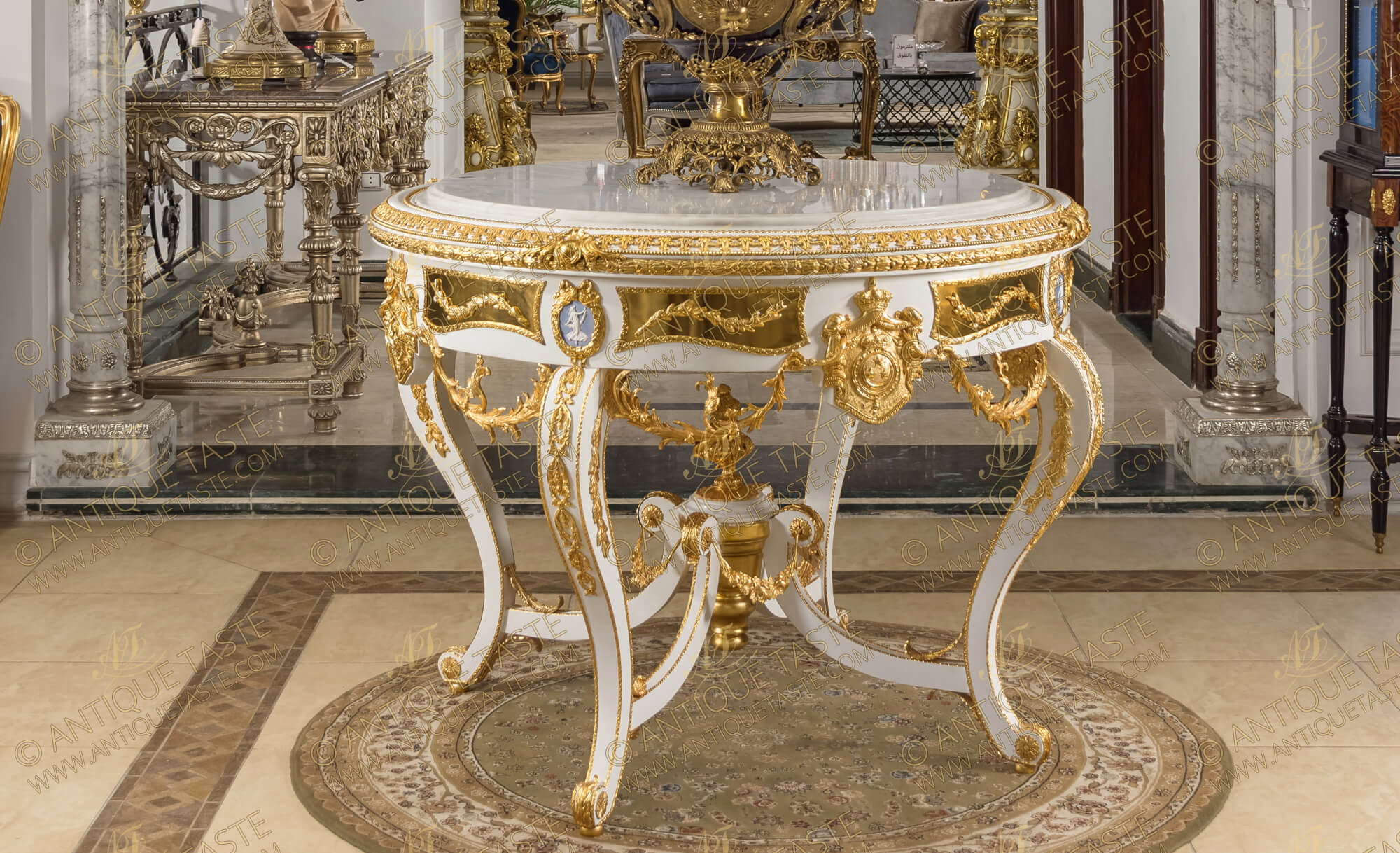 A lavish and luxuriant French Louis XV style gilt-ormolu-mounted white color Royal Center Table, elaborately adorned with the Royal Family Coat of Arms, Wedgwood jasperware plaques, with white marble top and extensive ormolu foliate ornamentation.
