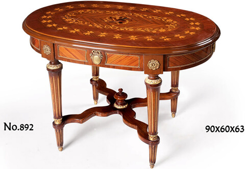 Napoleon III ormolu-mounted marquetry and veneer inlaid oval shaped Center Table on the Louis XVI style