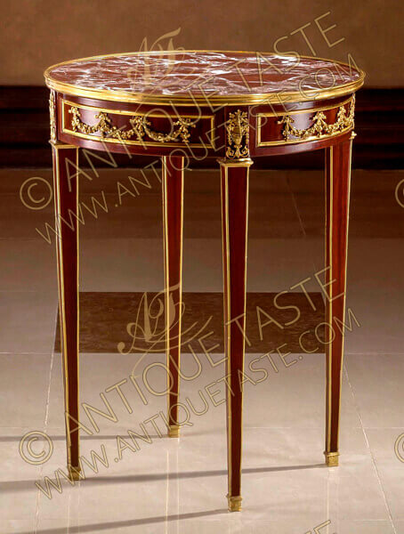 An elegant late 18th century Louis XVI Neo-Classical style gilt-ormolu-mounted veneer inlaid Table Bouillotte after the model by Adam Weisweiler