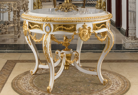 A lavish and luxuriant French Louis XV style gilt-ormolu-mounted white color Royal Center Table, elaborately adorned with the Royal Family Coat of Arms, Wedgwood jasperware plaques, with white marble top and extensive ormolu foliate ornamentation