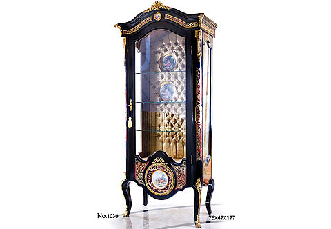 Opulent French Louis XV style ebonized Vitrine with André Charles Boulle style marquetry panels, ormolu and Sèvres porcelain plaques mounted, cut brass and tortoiseshell inlaid, capitonné style interior upholstered and cabriole legs