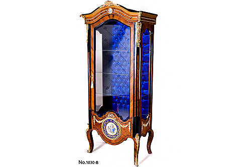 Louis XV style ormolu and cobalt blue ground Sèvres porcelain plaques mounted Vitrine, parcel ebonized and veneer inlaid, capitonné style interior and cabriole legs with ormolu acanthus sabots